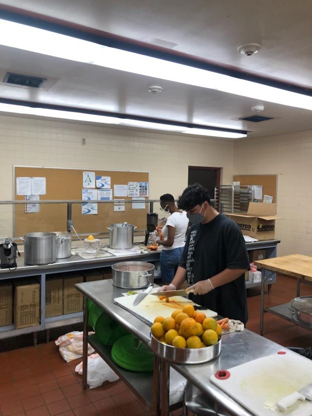 Youth working in kitchen