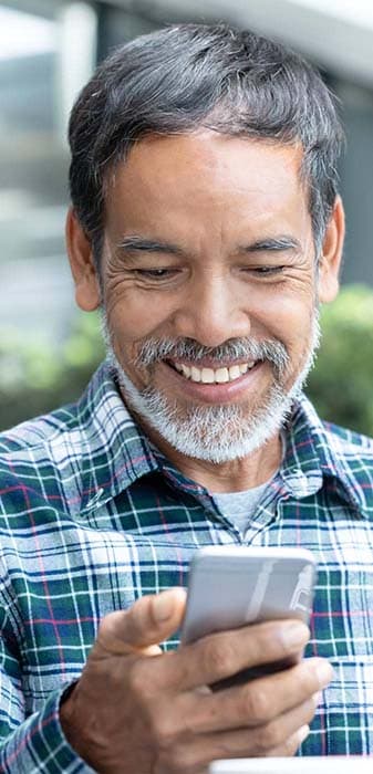 A person looking at a mobile phone screen.