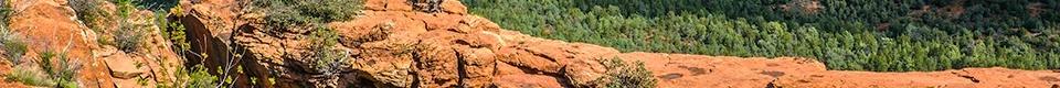 Red rock mountains rising from a desert landscape