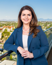 a woman wearing a business suite